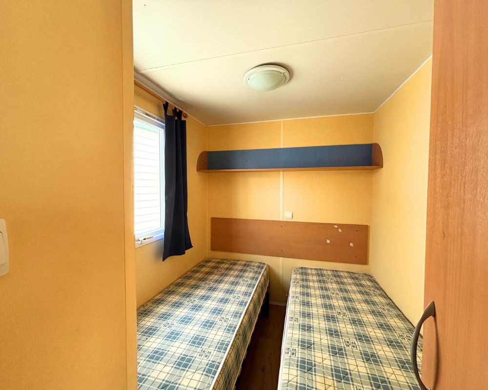Mobil-home occasion super octalia bleu, lits simples